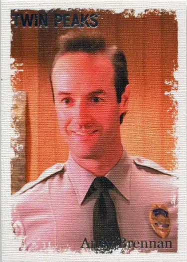 Smiling man in tan police uniform featured in Twin Peaks Original Stars trading card