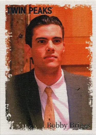 Portrait of a young man in a dark suit and orange tie from Twin Peaks Original Stars trading cards