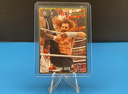 Wrestling trading card of Sami Zayn from Panini Chronicles WWE celebrating in the ring