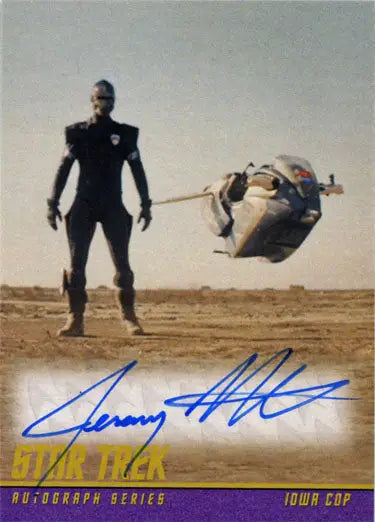 Futuristic Iowa Cop Jeremy Fitzgerald on barren ground with a hovering vehicle, Star Trek trading card