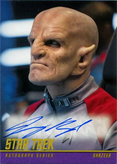 Alien character in red uniform from Star Trek played by Jeremy Raymond on trading card