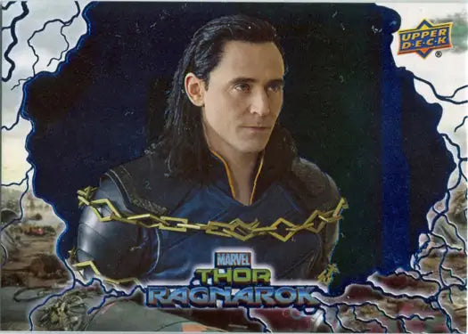 Character from Thor Ragnarok in dark clothing with gold accents on a blue foil trading card