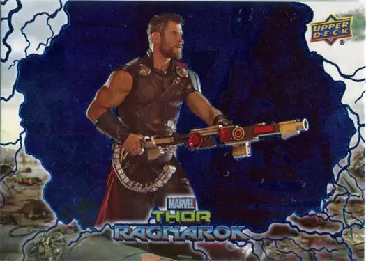 Muscular man in armor with futuristic weapon on Thor Ragnarok Blue Foil trading card