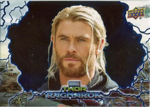 Blonde-haired man in armor on Thor Ragnarok blue foil trading card against dark backdrop