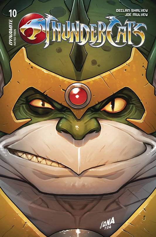 Comic book cover of THUNDERCATS #10 featuring a menacing green cat creature with glowing eyes