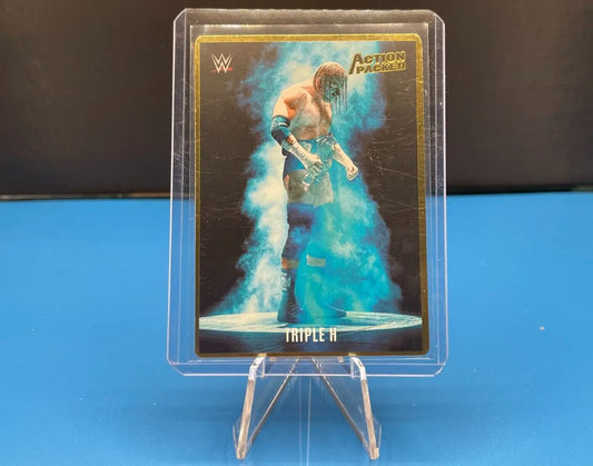 WWE trading card featuring Triple H in blue smoke, an action packed insert displayed