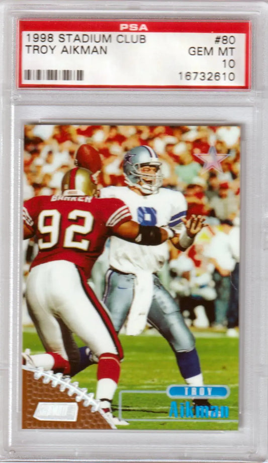 PSA graded 1996 Topps Stadium Club card featuring Troy Aikman under defensive pressure