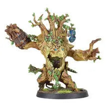 Fantastical tree-like creature with faces on a Blood Bowl gaming miniature base