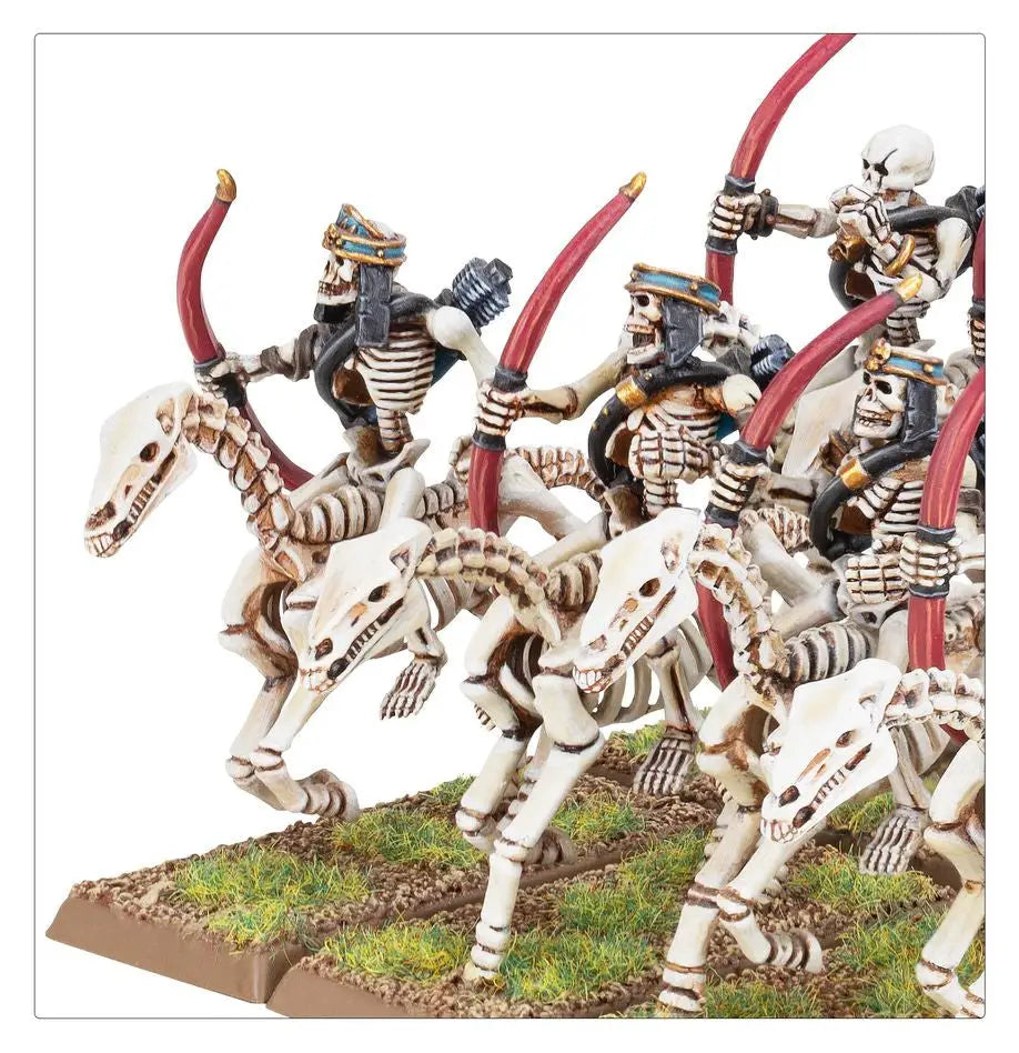 Skeletal horsemen led by Tomb Kings, wielding curved weapons on skeletal steeds