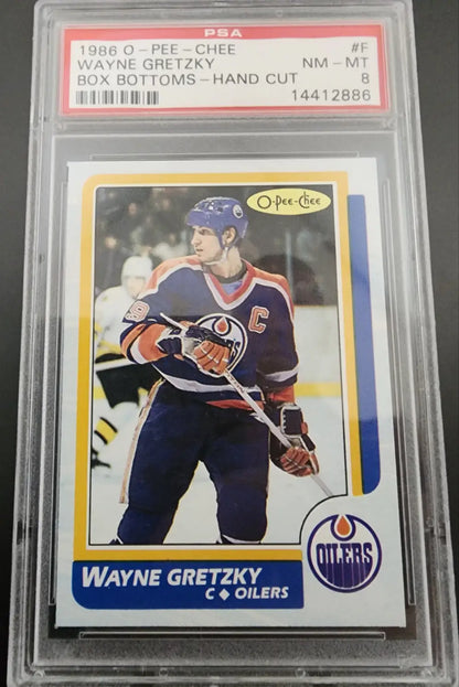 PSA-graded 1984-85 O-Pee-Chee Wayne Gretzky card in protective case for box bottoms psa