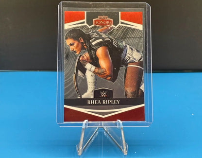 WWE 2023 Panini Chronicles Rhea Ripley Panini Honors card in clear display stand