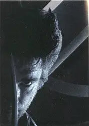 Partial view of a face in black and white on X-Men Movie promo card