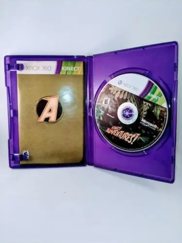 Open purple Xbox 360 Kinect Adventures game case with disc and manual tested inside