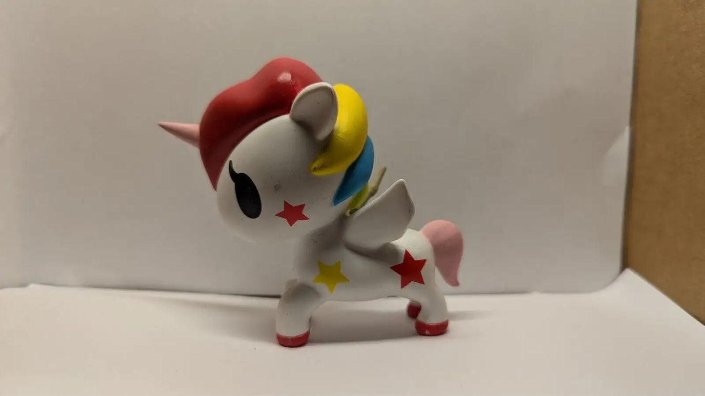 Colorful unicorn figurine from XXRAY Stellina Unicorno by Tokidoki x Jason Freeny